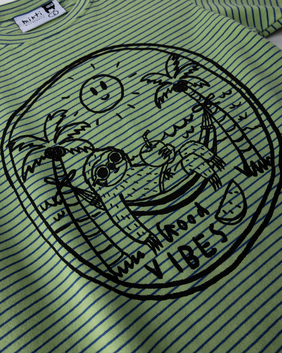 Close up of the Chill Sloth Tee print in lime stripe