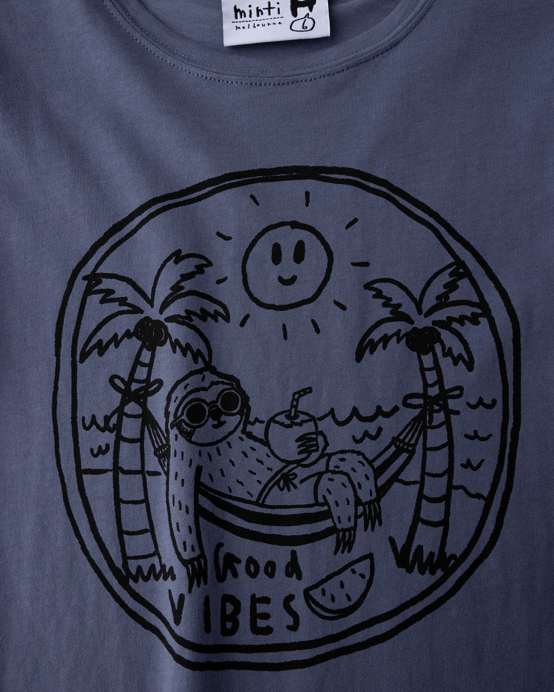 Close up of the Chill Sloth Tee print in muted blue