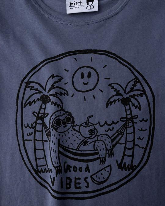 Close up of the Chill Sloth Tee print in muted blue