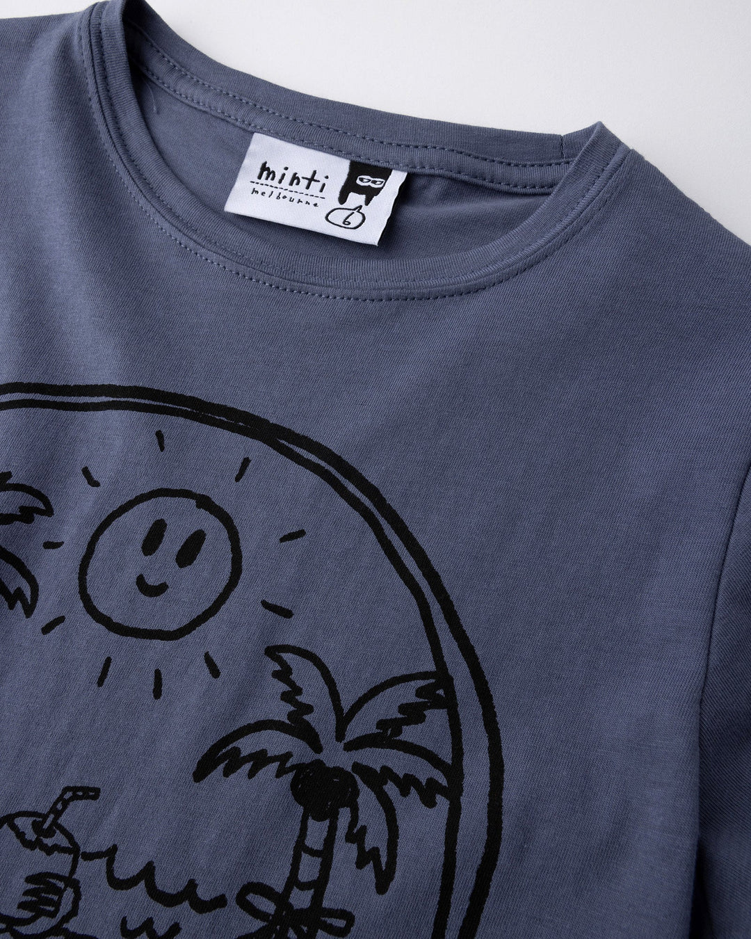Close up detail of the Chill Sloth Tee in muted blue