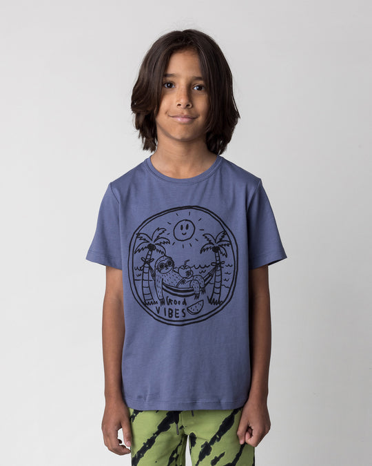 Close up of the Chill Sloth Tee in muted blue on a kid, front view