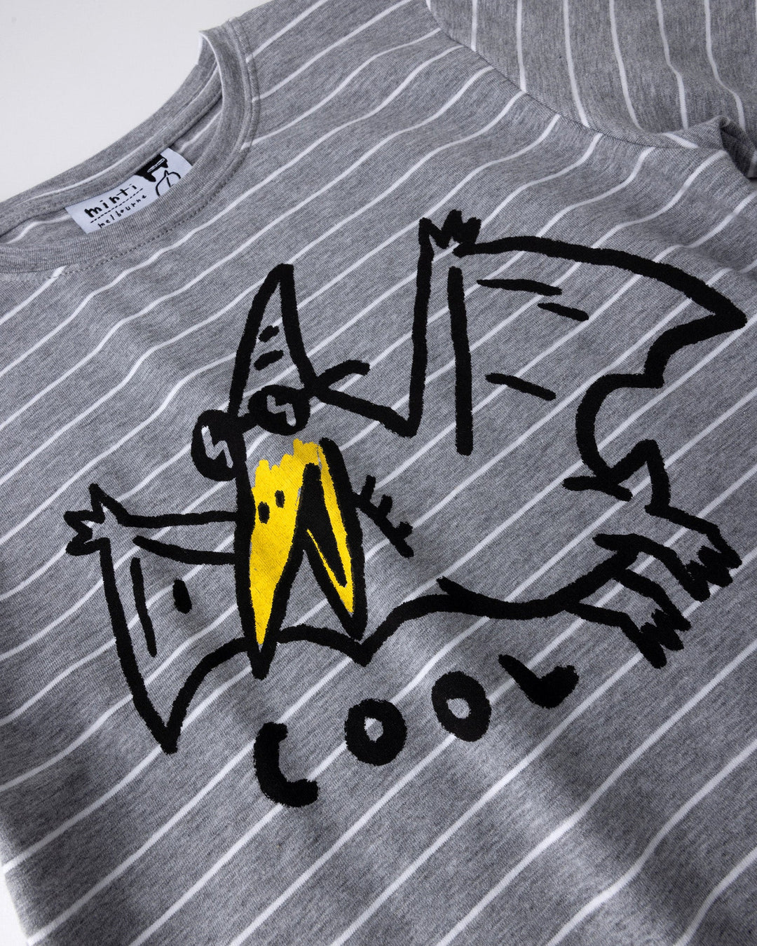 Close up of the Cool Pterodactyl Tee print in grey stripe