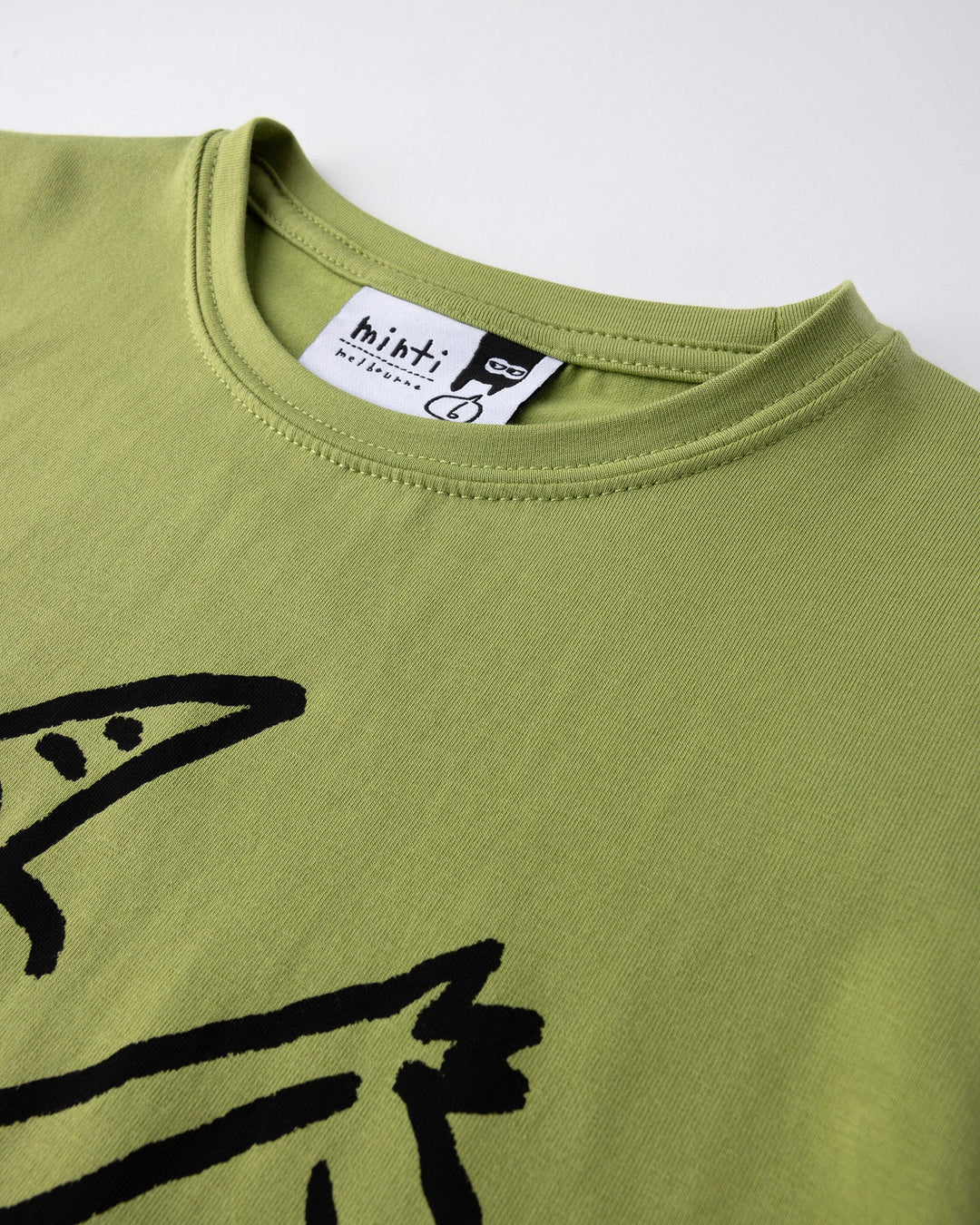 Close up detail of the Cool Pterodactyl Tee in lime