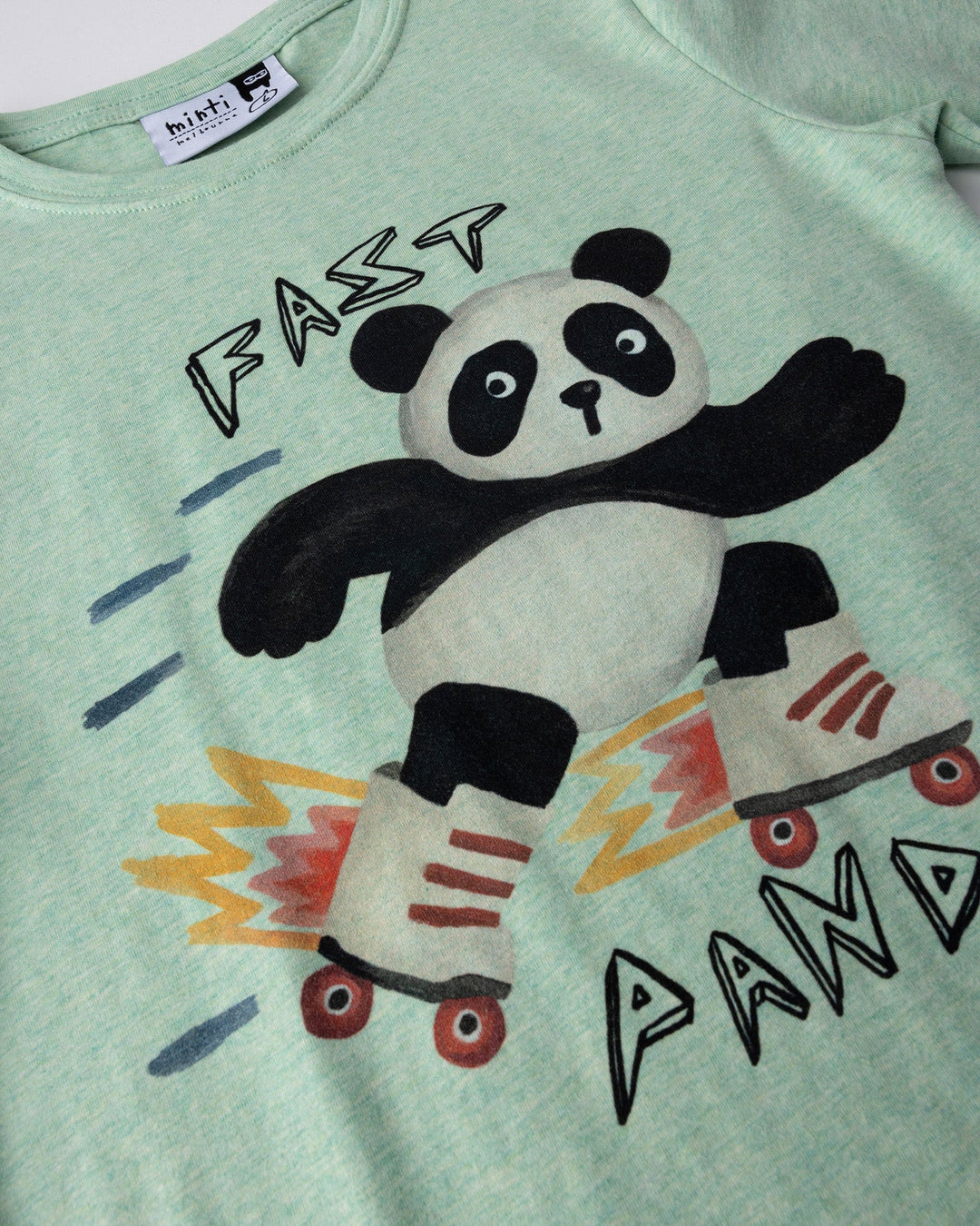 Close up of the Fast Panda Tee print in green marle