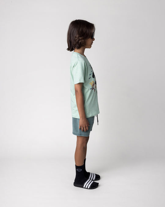 Kid wearing the Fast Panda Tee in green marle with the Blasted Track Short in forest wash, side view
