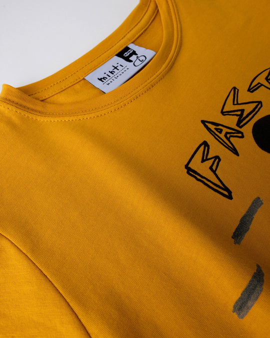 Close up detail of the Fast Panda Tee in mustard