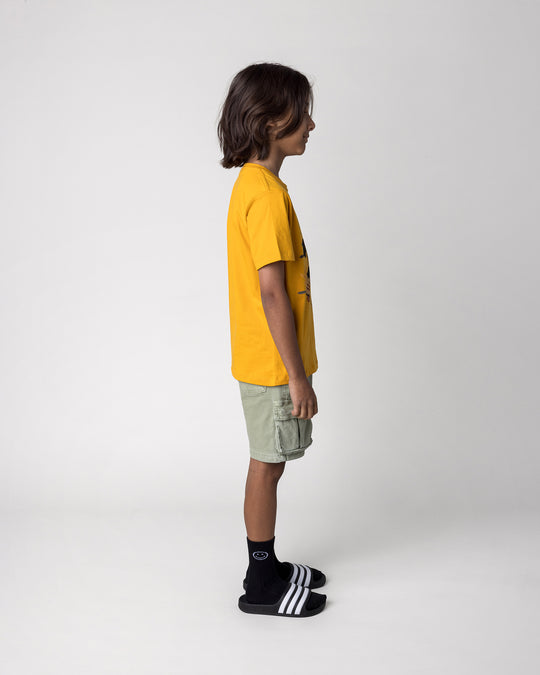 Kid wearing the Fast Panda Tee in mustard, side view