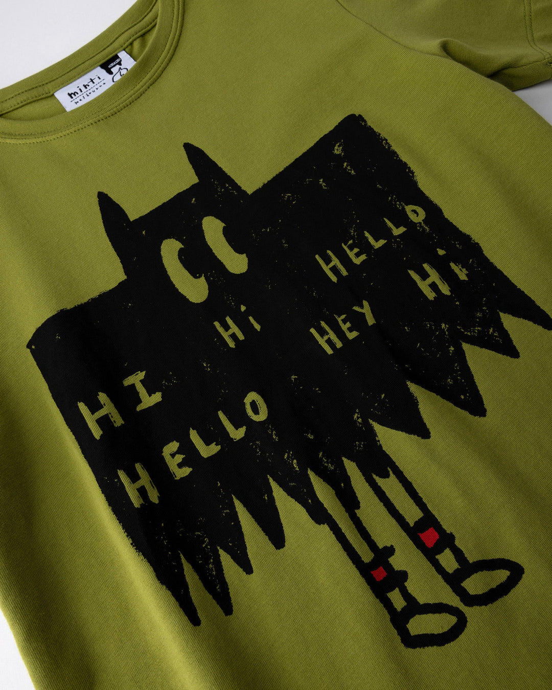 Close up of the Greetings Bat Tee print in olive