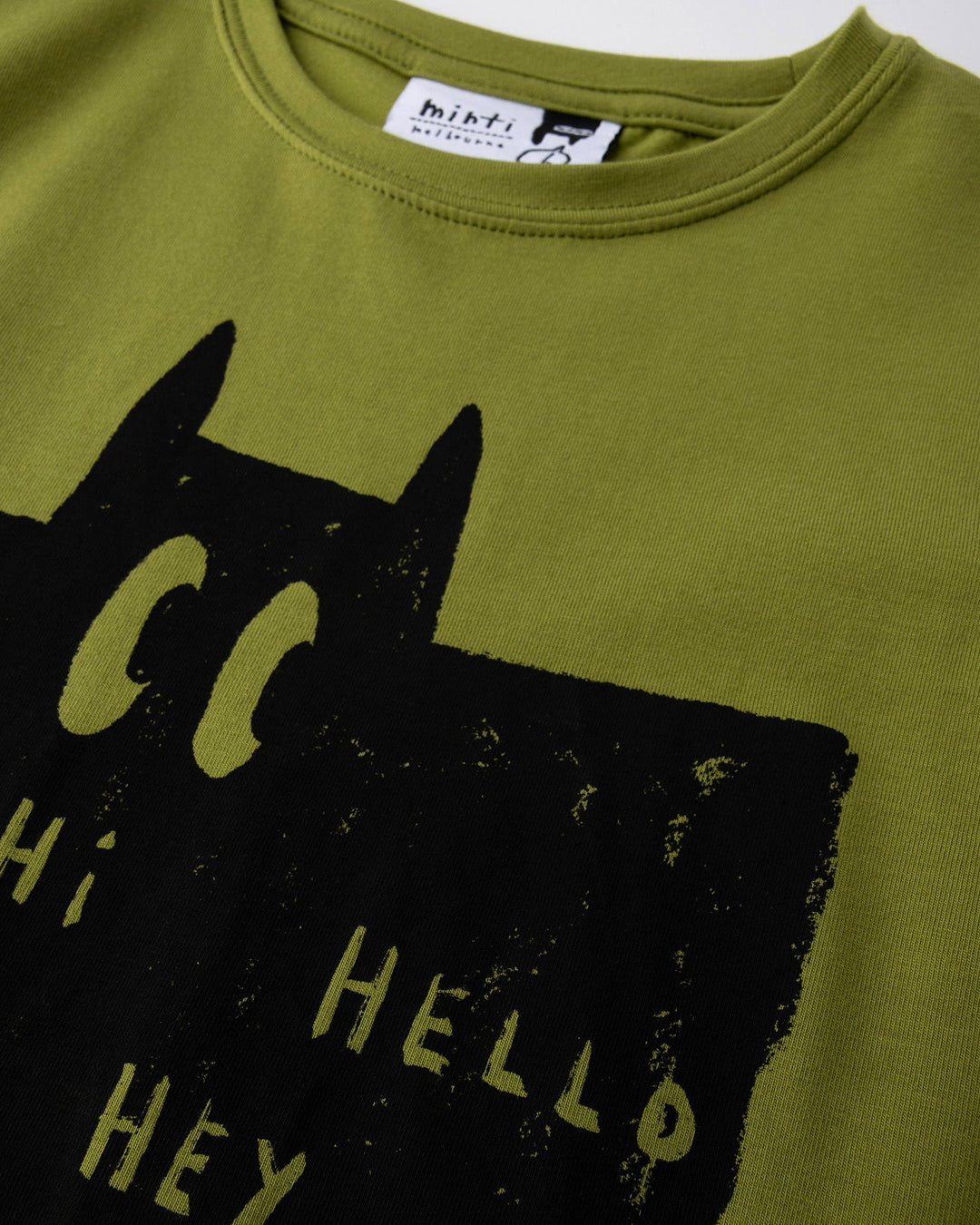 Close up of the Greetings Bat Tee print in olive