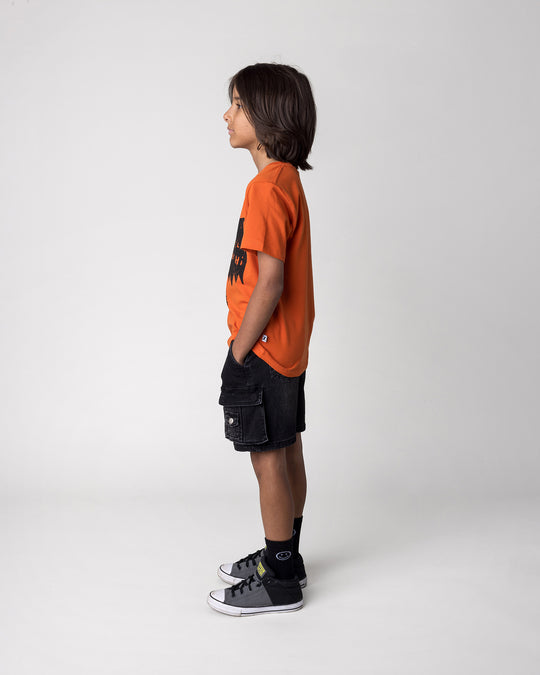 Kid wearing the Greetings Bat Tee in orange, side view