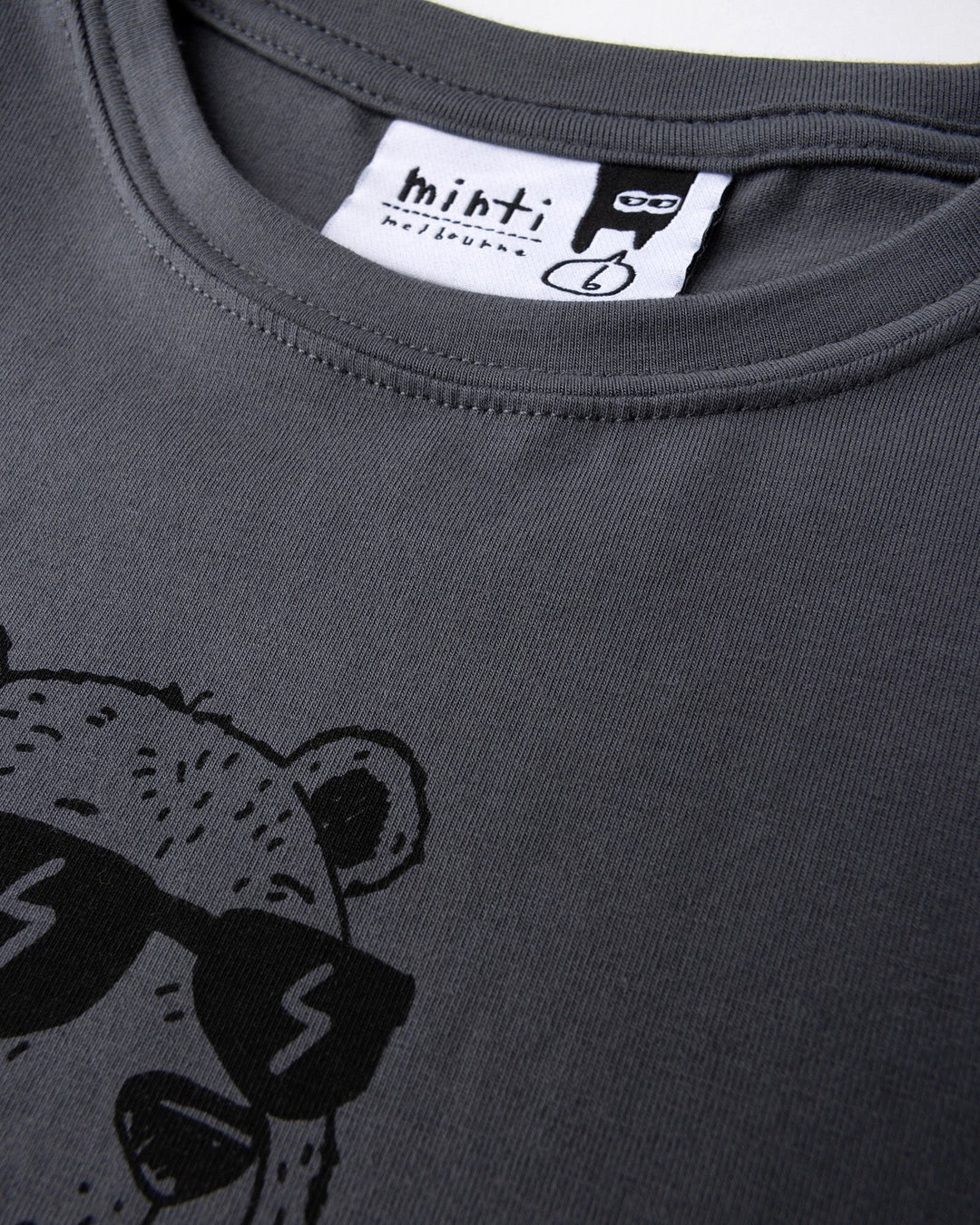 Close up detail of the Grizzly Tee in dark grey