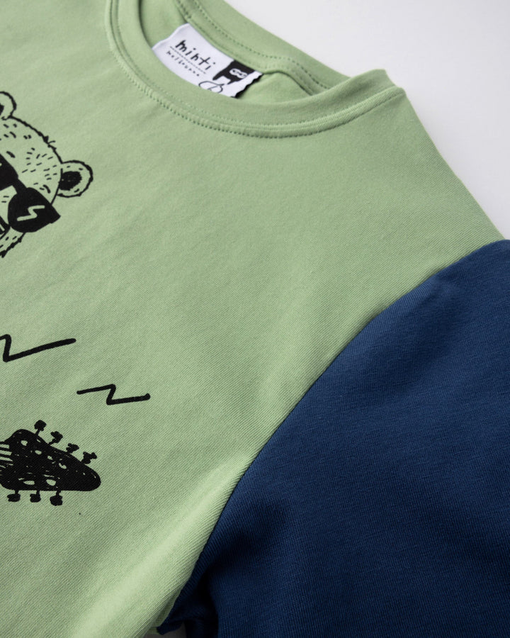 Close up detail of the Grizzly Tee in sage, yellow and midnight
