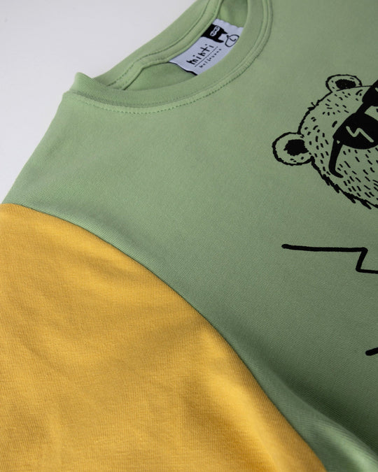 Close up detail of the Grizzly Tee in sage, yellow and midnight