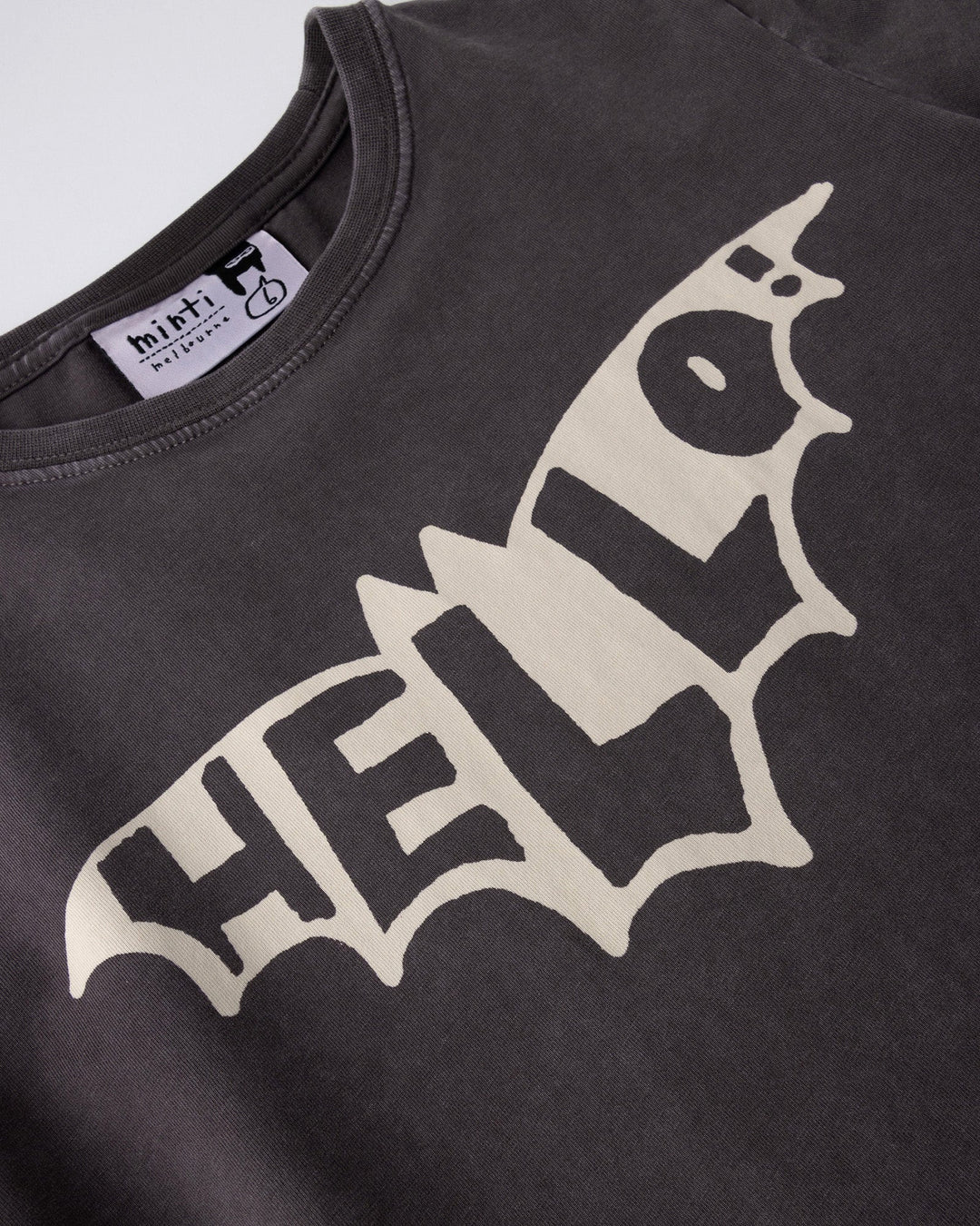 Close up of the Hello Bat Tee print in black wash