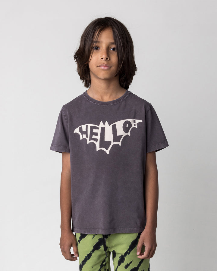 Close up of the Hello Bat Tee in black wash on a kid, front view