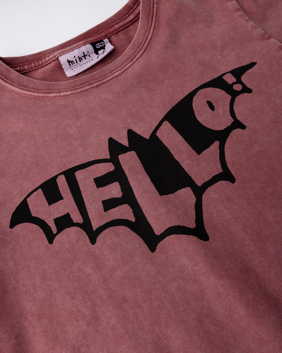 Close up of the Hello Bat Tee print in burnt red wash