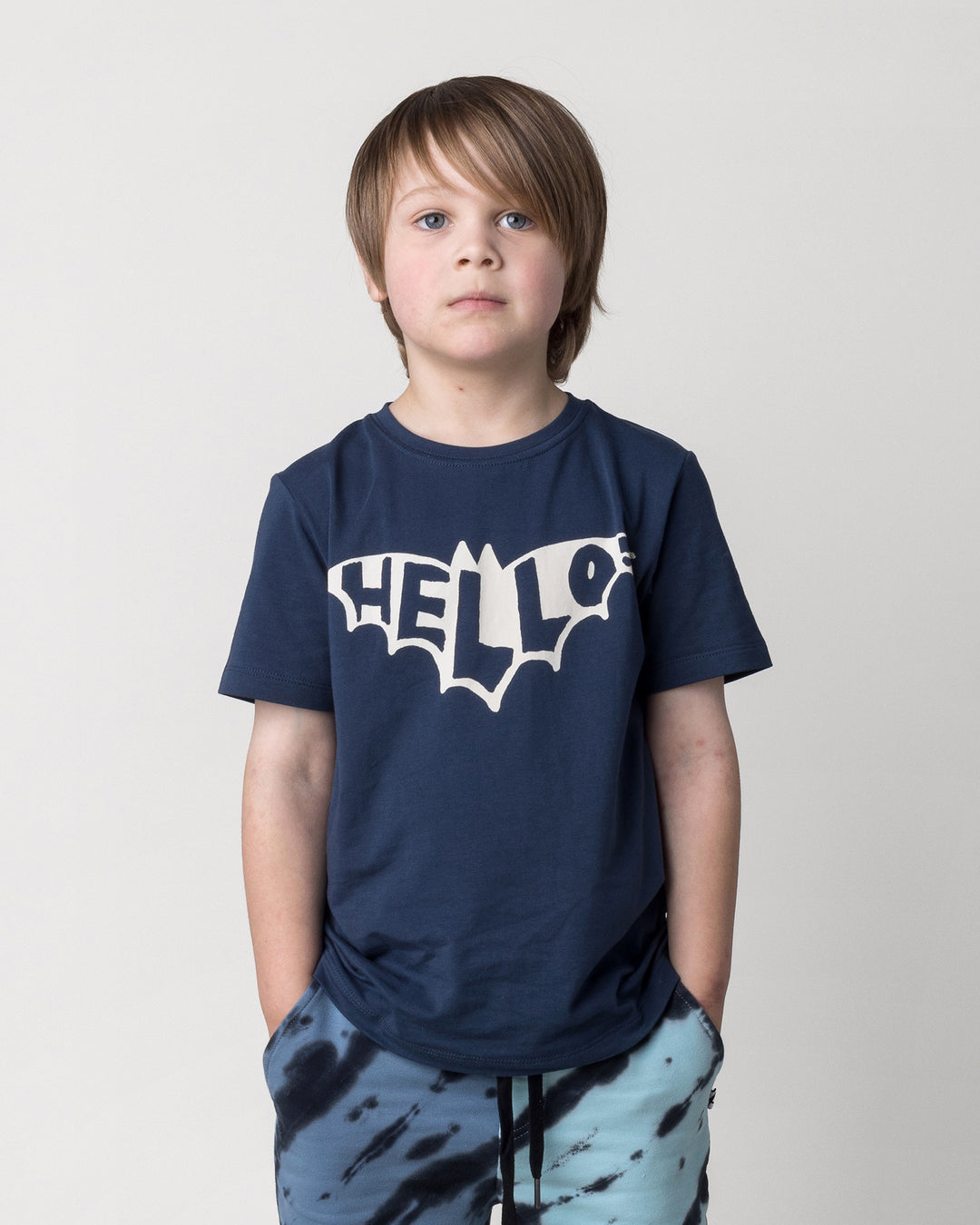 Close up of the Hello Bat Tee in ink on a kid, front view