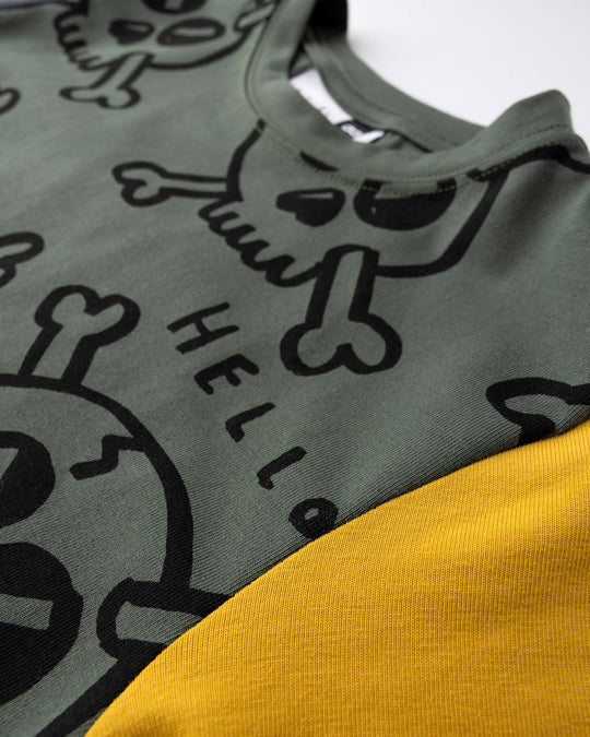 Close up of the Hello Skull Tee print in forest, dark grey and yellow