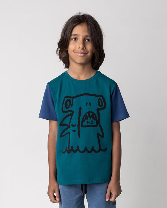 Close up of the Hi Hammerhead Tee in dark teal and midnight on a kid, front view