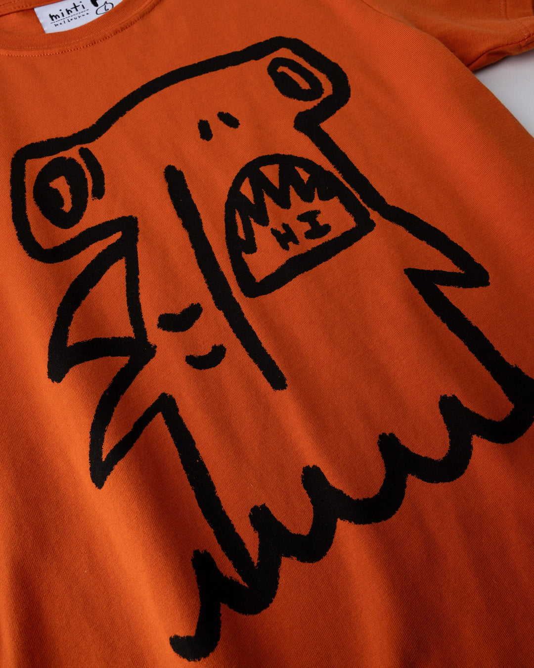 Close up of the Hi Hammerhead Tee print in orange