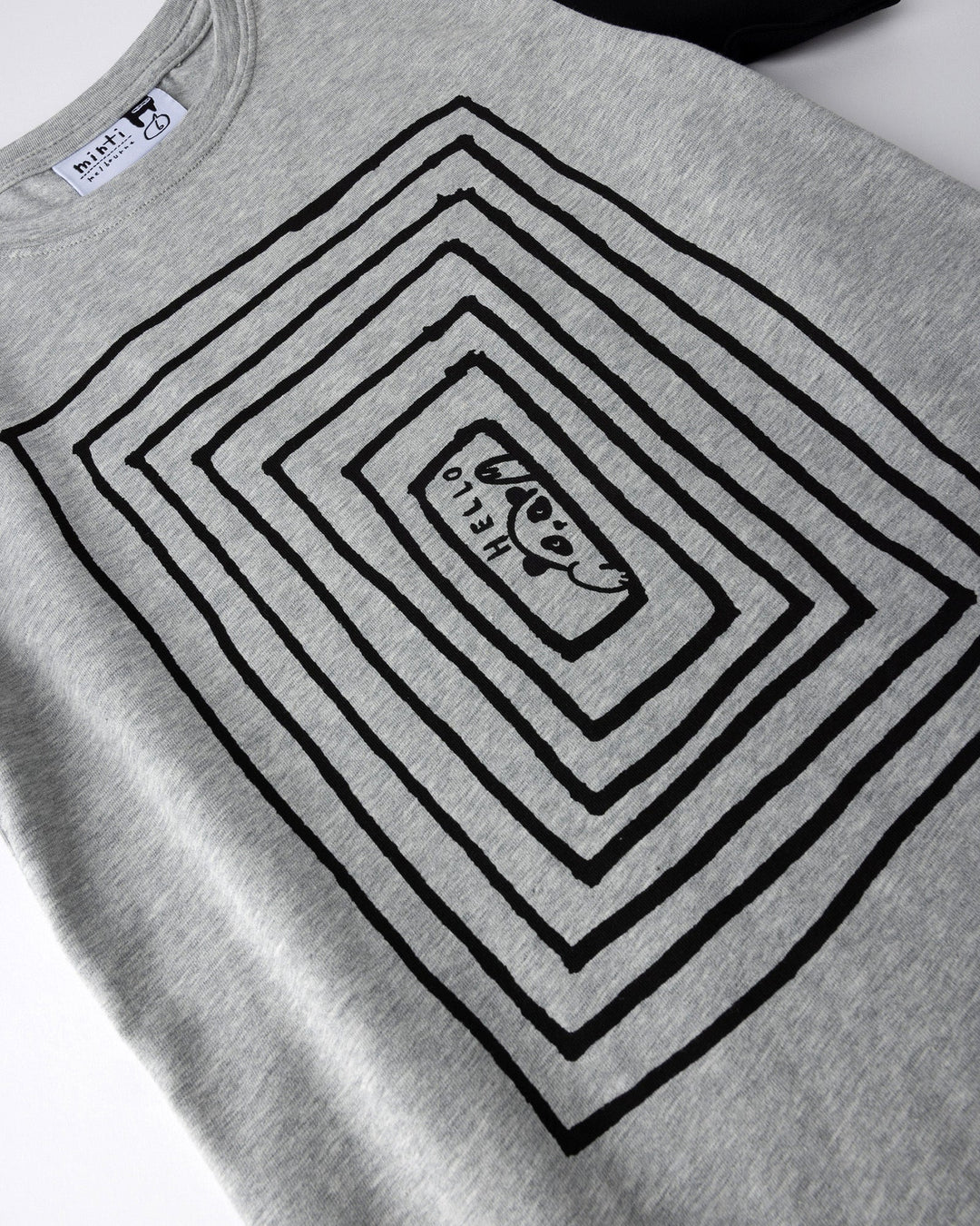 Close up of the Hidden Panda Tee print in grey marle and black