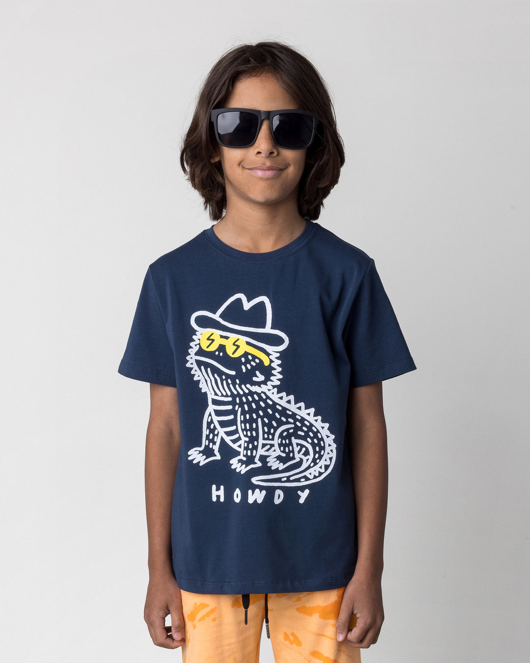 Close up of the Howdy Lizard Tee in ink on a kid, front view