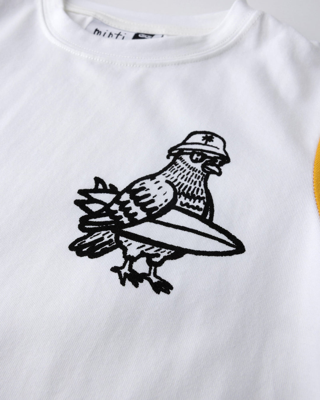 Close up of the Hi Pigeon Tee print in white, midnight and yellow