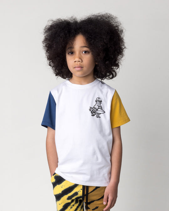 Close up of the Hi Pigeon Tee in white, midnight and yellow on a kid, front view