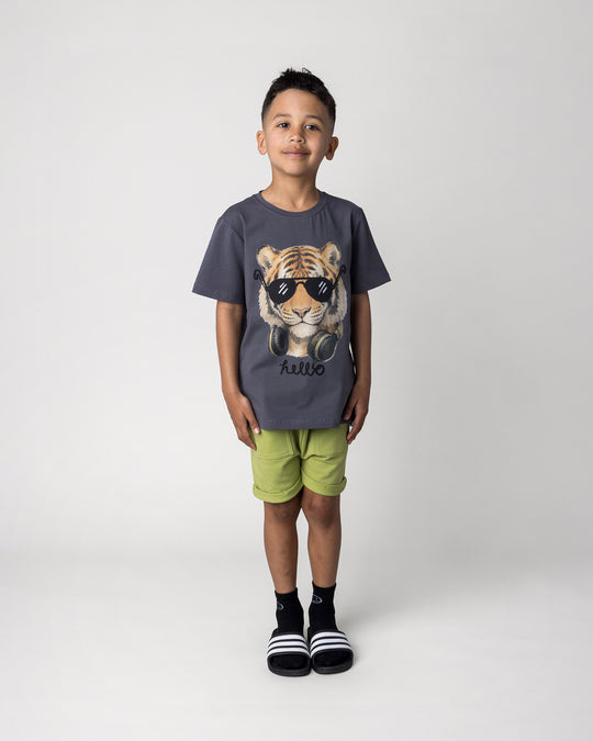 Kid wearing the Headphones Tiger Tee in dark grey with the Roller Short in lime, front view