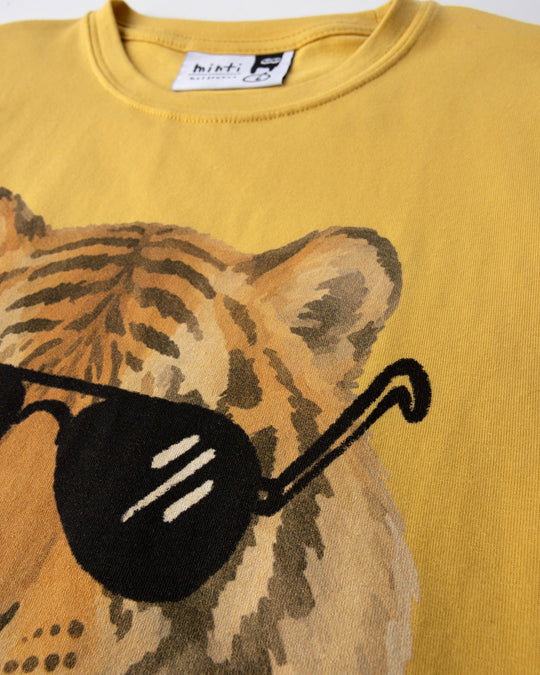 Close up of the Headphones Tiger Tee print in dull yellow