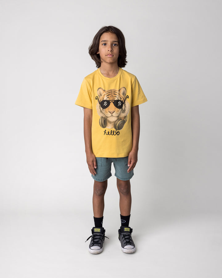 Kid wearing the Headphones Tiger Tee in dull yellow with the Blasted Track Short in forest wash, front view