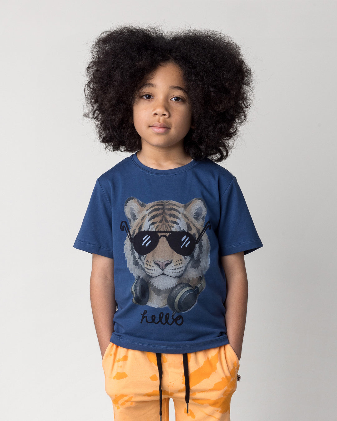 Close up of the Headphones Tiger Tee in midnight on a kid, front view