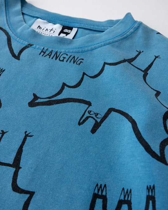 Close up of the Just Hanging Tee print in sky wash