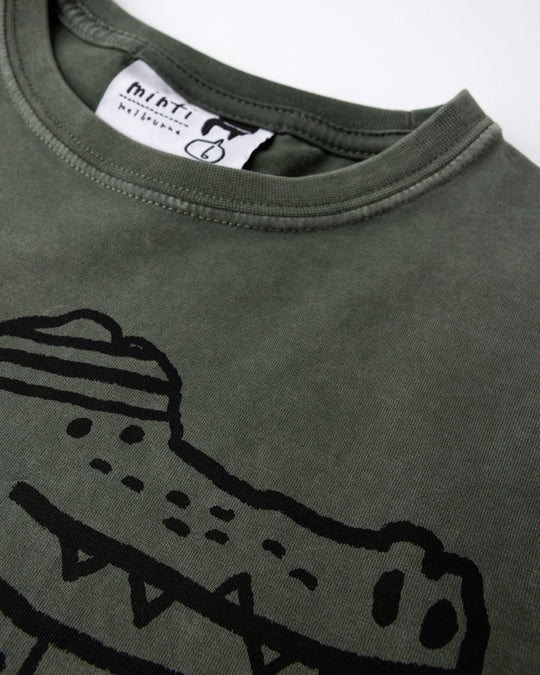 Close up of the Later Gator Tee print in olive wash