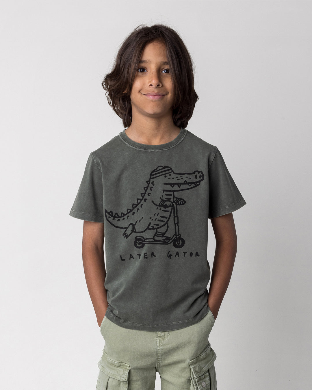 Close up of the Later Gator Tee in olive wash on a kid, front view