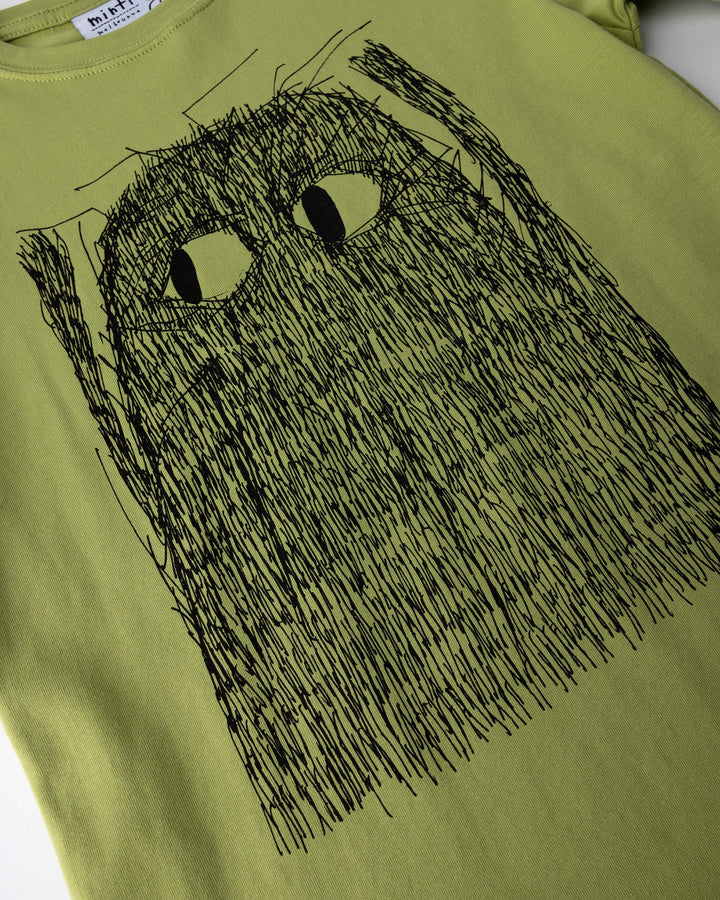 Close up of the Messy Monster Tee print in lime