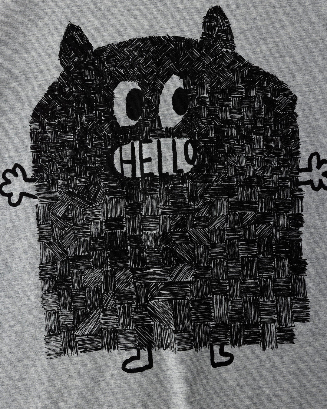 Close up of the Patchwork Monster Tee print in grey marle and black
