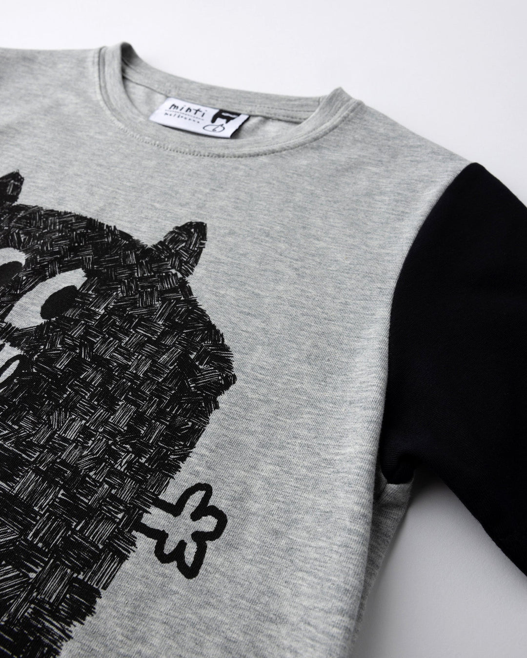 Close up detail of the Patchwork Monster Tee in grey marle and black