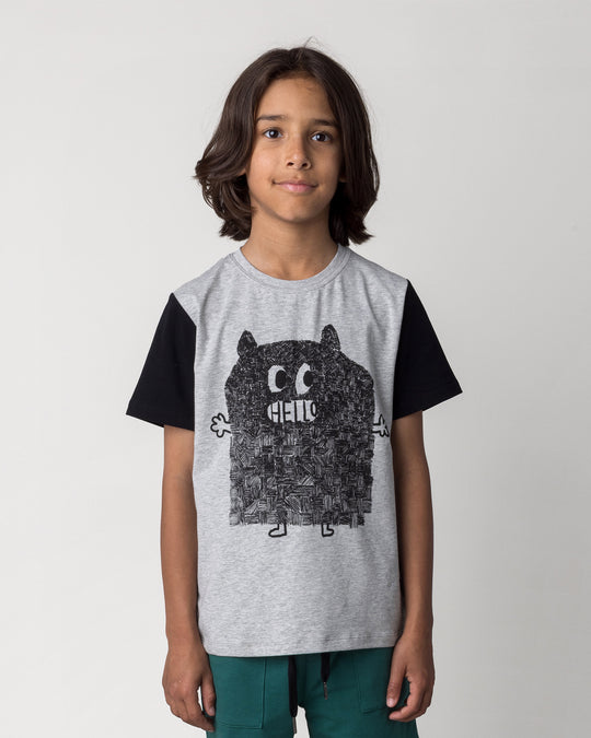 Close up of the Patchwork Monster Tee in grey marle and black on a kid, front view