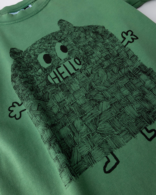 Close up of the Patchwork Monster Tee print in turf wash