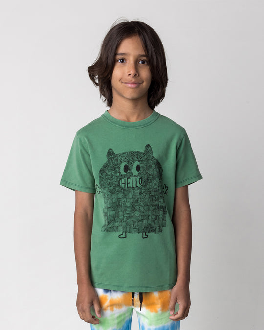 Close up of the Patchwork Monster Tee in turf wash on a kid, front view
