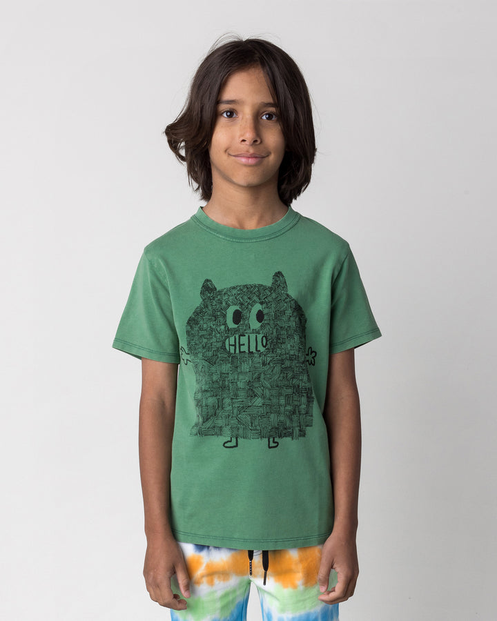 Close up of the Patchwork Monster Tee in turf wash on a kid, front view
