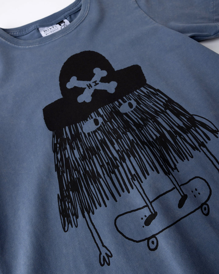 Close up of the Pirate Skater Tee print in blue wash