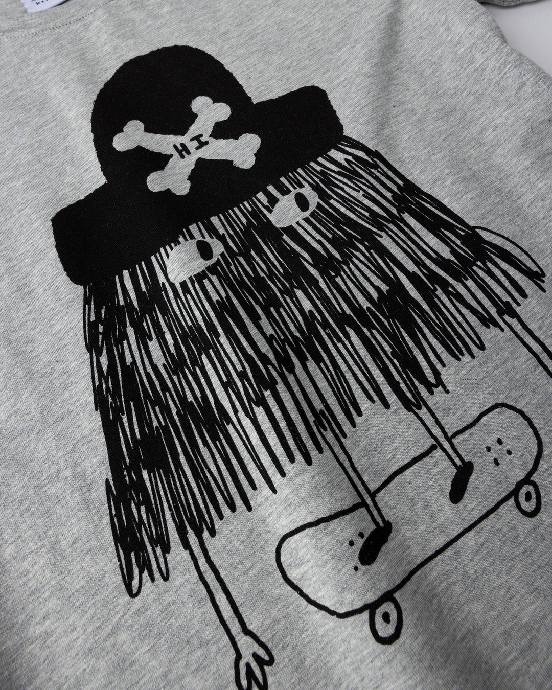 Close up of the Pirate Skater Tee print in grey marle