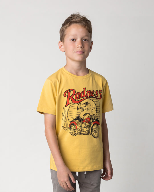 Close up of the Radness Tee in dull yellow on a kid, front view