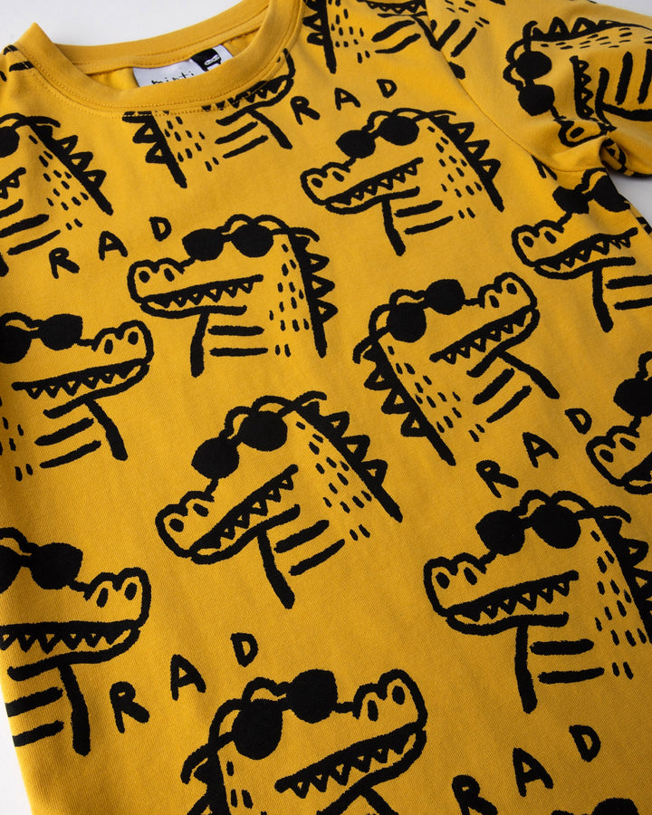 Close up of the Rad Croc Tee print in mustard
