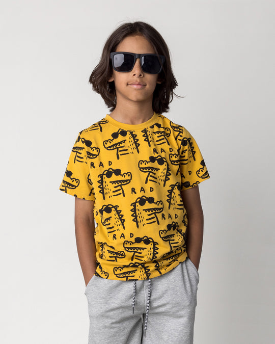Close up of the Rad Croc Tee in mustard on a kid, front view