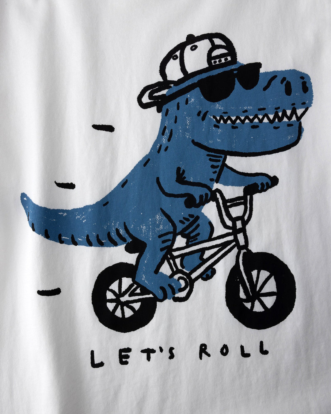 Close up of the Rex Rider Tee print in off white