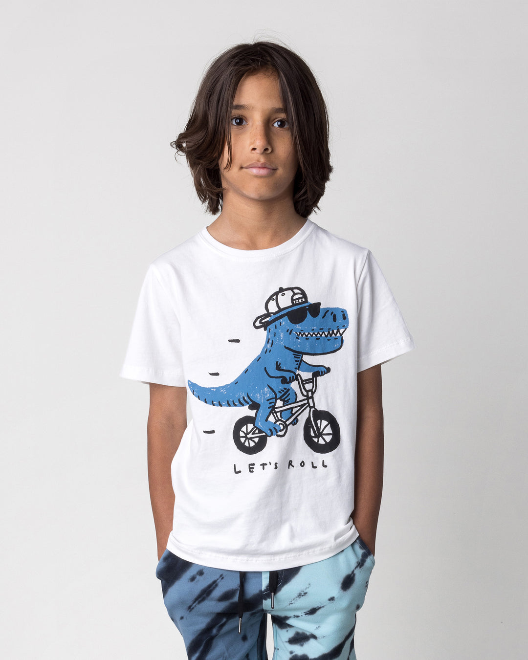 Close up of the Rex Rider Tee in off white on a kid, front view