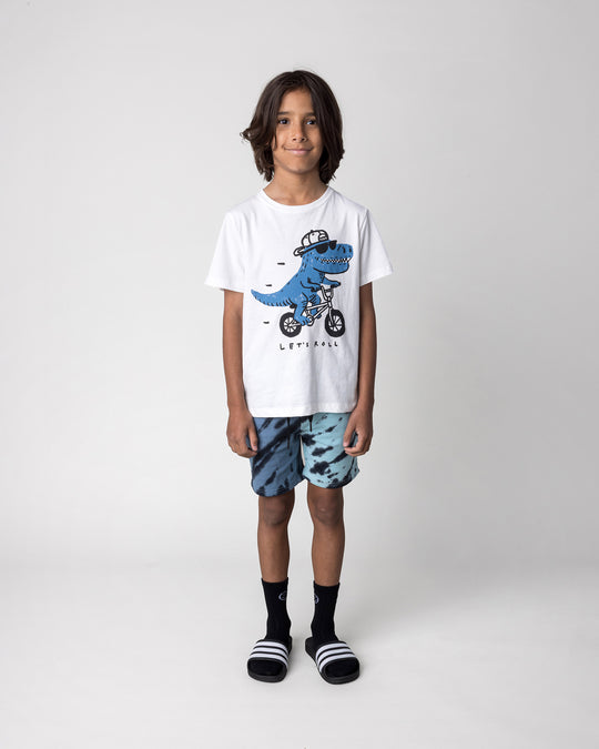 Kid wearing the Rex Rider Tee in off white with the Duo Tie Dye Short in blue and aqua, front view